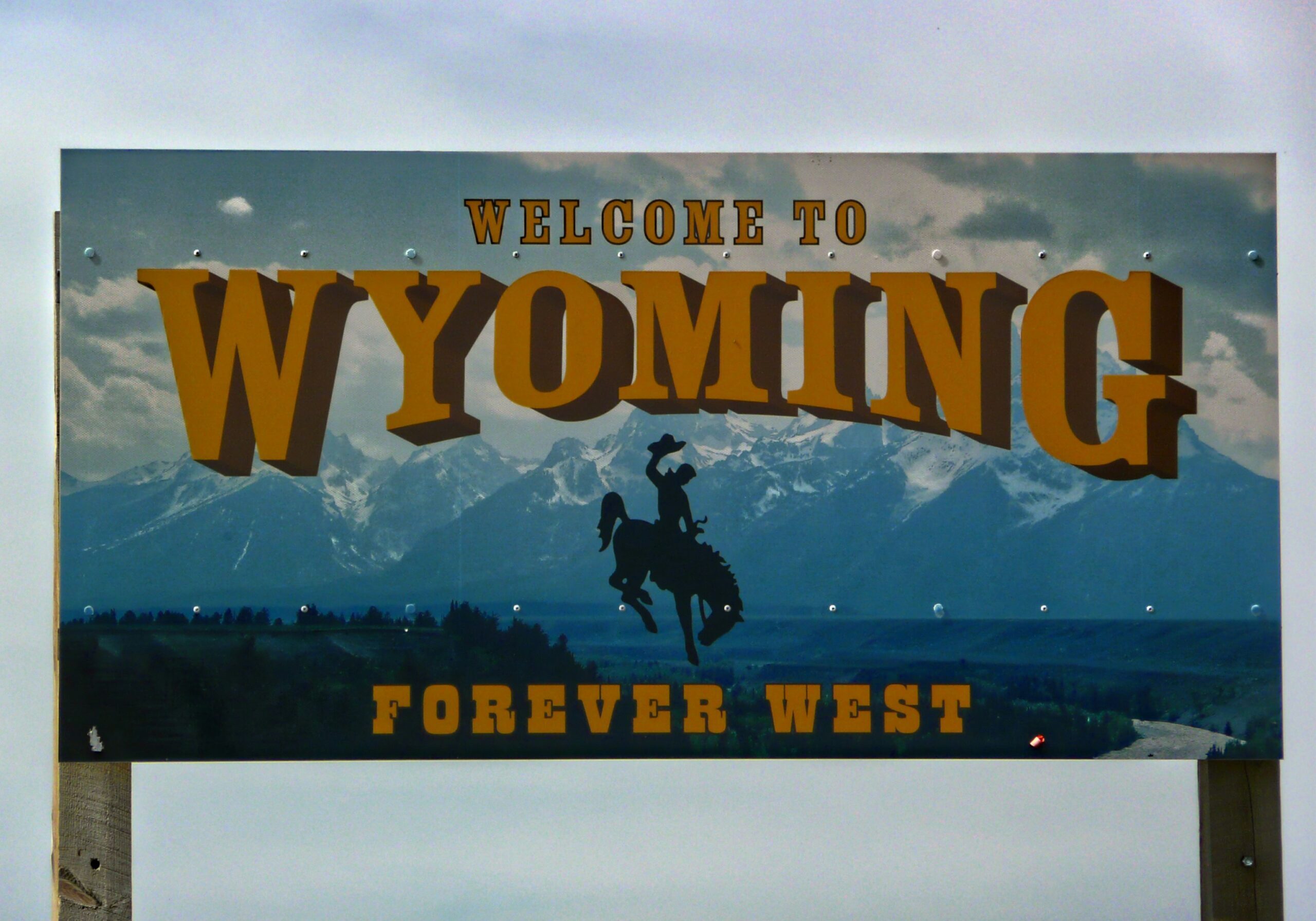 Sign that says welcome to Wyoming forever west